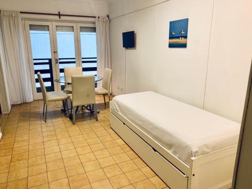 Posteľ alebo postele v izbe v ubytovaní Cabo Corrientes Center