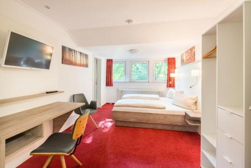 Hotel Hopener Wald ,Self Check Inにあるベッド