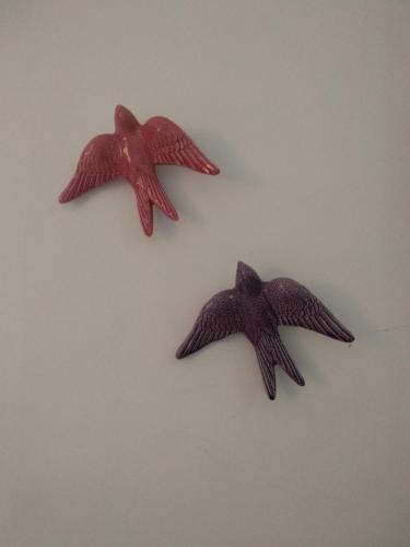 two star fish figurines hanging on a wall at Bea's Bed & Breakfast in Tavira
