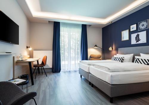 Postel nebo postele na pokoji v ubytování Hotel Wittorf