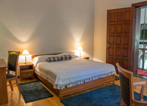 Postel nebo postele na pokoji v ubytování Hotel Daria Dworek Myśliwski