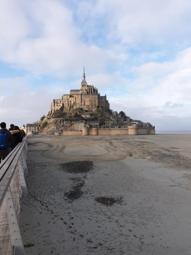 a large building on an island in the ocean at Cosy Er Lann Chambres d'Hôtes in Val Couesnon