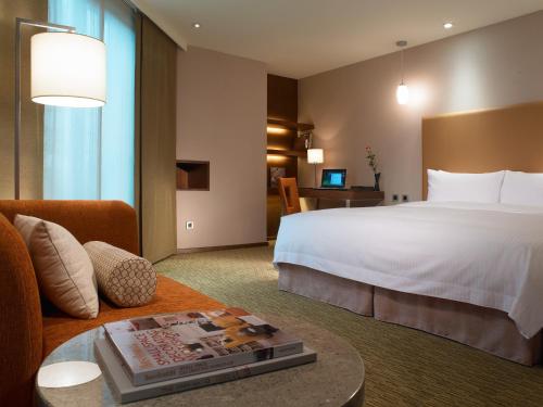 Tempat tidur dalam kamar di Classic City Resort