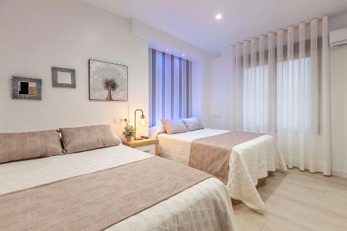 Ein Bett oder Betten in einem Zimmer der Unterkunft Great Apartment Granada City Centre