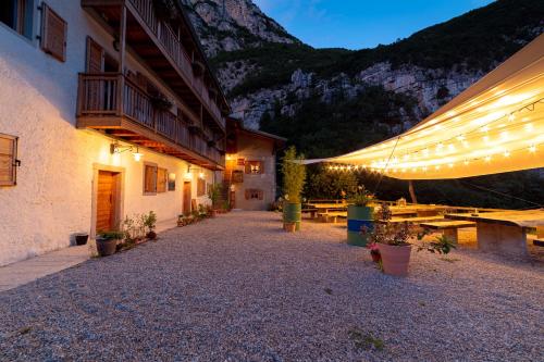 a courtyard of a building with lights on it at Limarò B&B in Sarche di Calavino