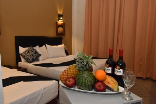 a plate of fruit on a table in a hotel room at Nil Diya Mankada Safari Lodge in Udawalawe