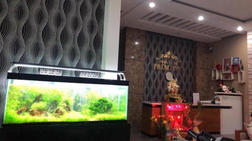 a large fish tank in a room with at Phuong Thao Motel in Da Nang