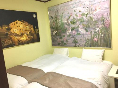 Cama o camas de una habitación en Oasis Minamiyukigaya