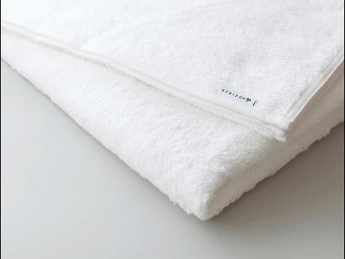 a white bedsheet with the word mattress on it at 9h nine hours Nagoya station in Nagoya