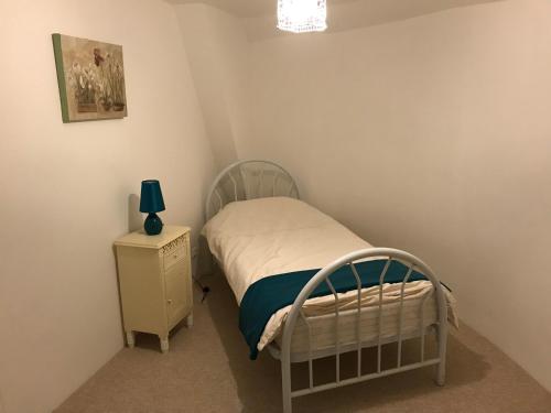 Postel nebo postele na pokoji v ubytování Orchid Cottage