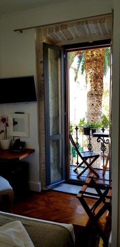 a living room with a sliding glass door to a patio at San Teodoro in Korčula