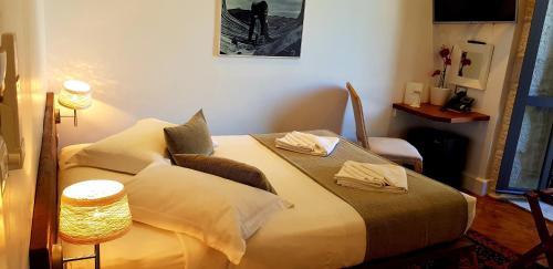 a bedroom with a large bed with pillows at San Teodoro in Korčula