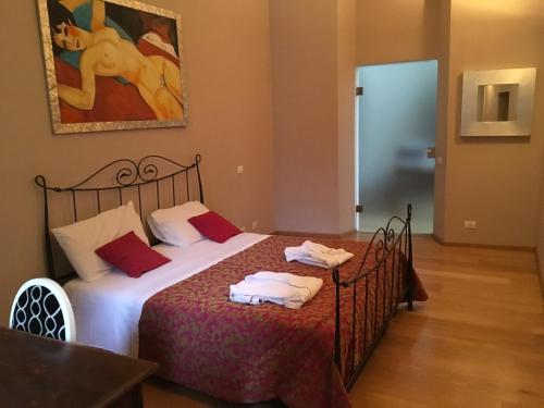 a bedroom with two beds with towels on them at Chez Anna in Iesi