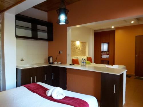 a kitchen with a counter with towels on it at Sahara Gardens-Kericho in Kericho