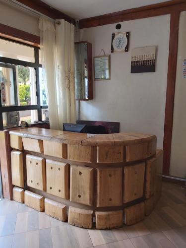 a large stack of wooden barrels in a room at Sahara Gardens-Kericho in Kericho