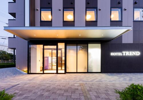 a building with glass doors on the side of it at Hotel Trend Mikawaanjo in Anjomachi