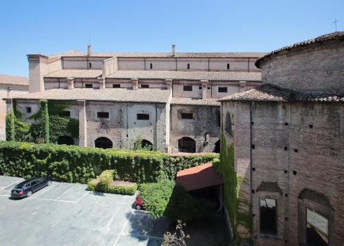 an aerial view of an old building with a parking lot at Residence Liberty in Parma