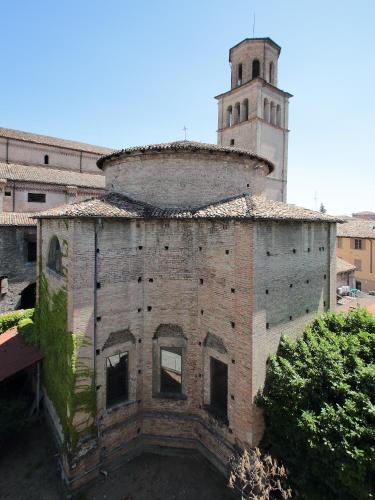 an old brick building with a tower on top of it at Residence Liberty in Parma