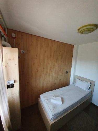 Ένα ή περισσότερα κρεβάτια σε δωμάτιο στο Hotel Nova Residence