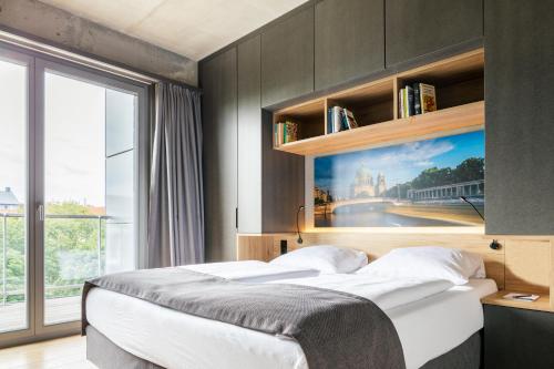 Letto o letti in una camera di Downtown Apartments Mitte