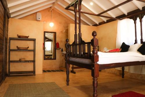 A bed or beds in a room at Namaste Jungle - A Boutique Homestay