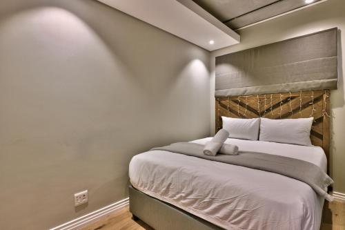 Кровать или кровати в номере Docklands