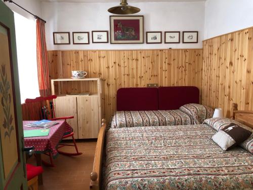 Postel nebo postele na pokoji v ubytování CA' POGGIOLO