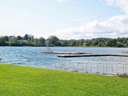 a dock in the middle of a large lake at 6 person holiday home in ED in Ed