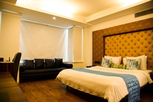 Postel nebo postele na pokoji v ubytování Virohaa Hotel