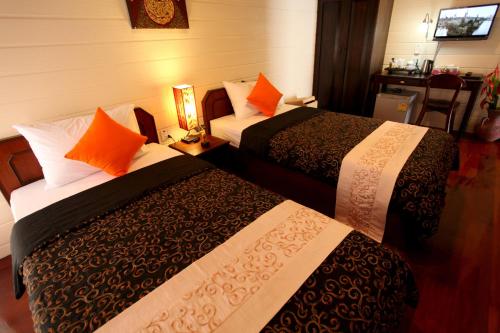 Ένα ή περισσότερα κρεβάτια σε δωμάτιο στο Ao Nang Home Stay - Adults Only