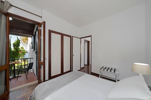 Ένα ή περισσότερα κρεβάτια σε δωμάτιο στο Casa do Lido by An Island Apart