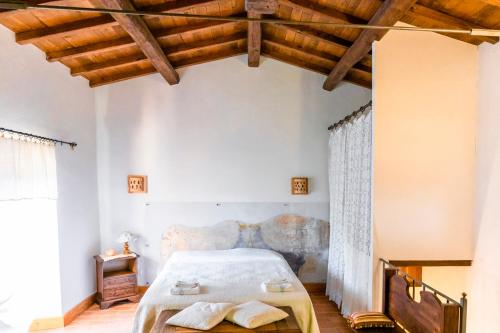 Posteľ alebo postele v izbe v ubytovaní La Casetta Madonna di Morciano