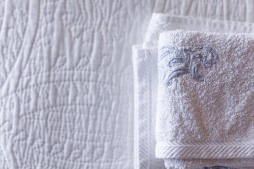 a close up of a white towel on a bed at La Casetta Madonna di Morciano in Bagnoregio