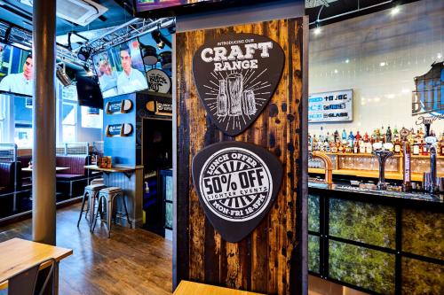 a bar with a sign for a craft bar at St Christopher's Inn Hammersmith in London
