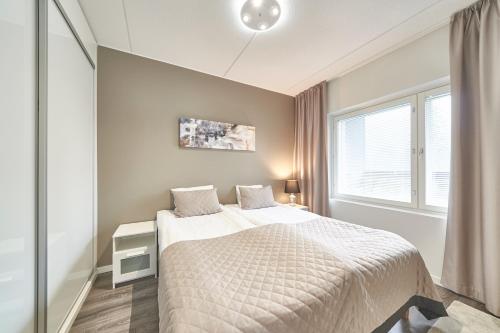 Postel nebo postele na pokoji v ubytování Tahko Spa Hotel