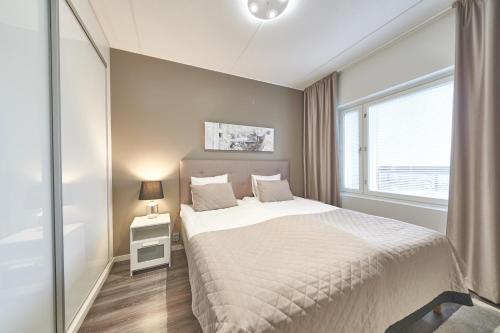 Postel nebo postele na pokoji v ubytování Tahko Spa Hotel
