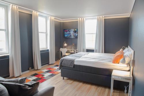 Säng eller sängar i ett rum på Hotel Stensson