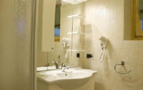 a bathroom with a sink and a mirror at Baita Veglia in Livigno