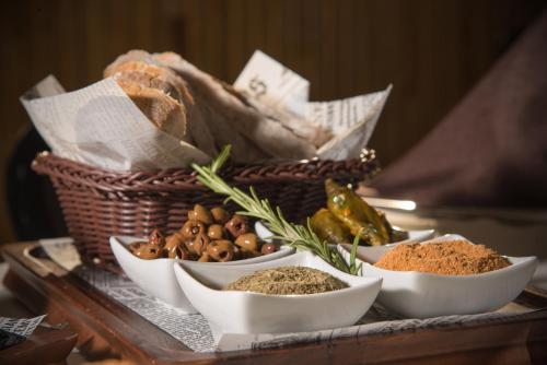 a tray with different types of spices and a basket at Hotel Villa Magus in Kladnitsa