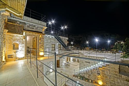 a view of a building at night with lights at Risus Cave Suites in Goreme