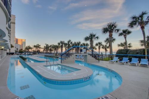 a large swimming pool with a slide at a resort at 11-th Floor OcenView w Balcony cozy condo at Boardwalk Resort in Myrtle Beach
