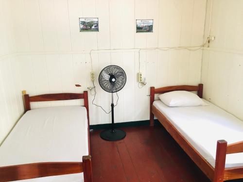 Een bed of bedden in een kamer bij Guesthouse De Kleine Historie
