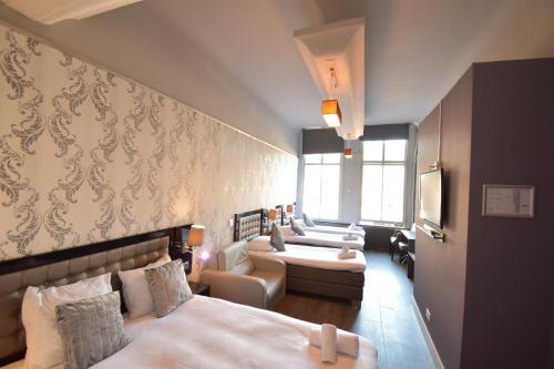 Cama o camas de una habitación en Hotel Hermitage Amsterdam