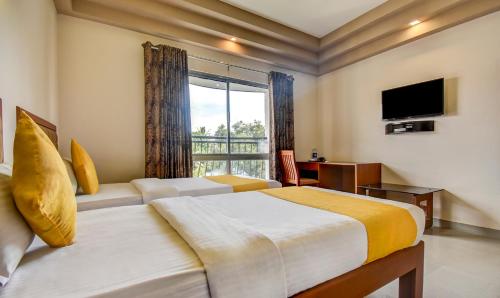 Katil atau katil-katil dalam bilik di Hotel Garden Inn