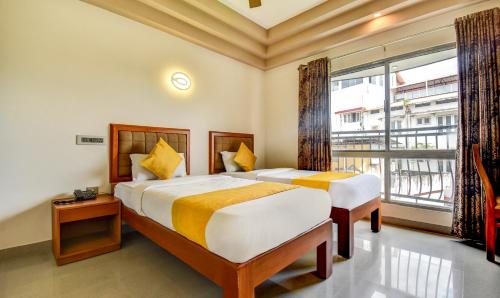 Katil atau katil-katil dalam bilik di Hotel Garden Inn