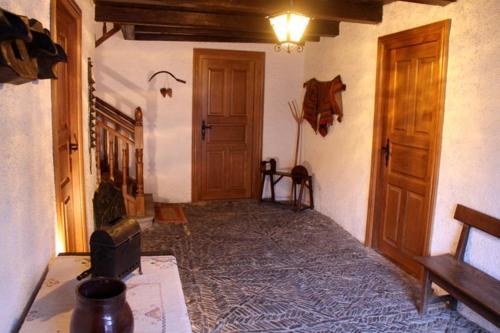 a room with a room with a bed and wooden doors at CASA GRACIANO I in Ochagavía