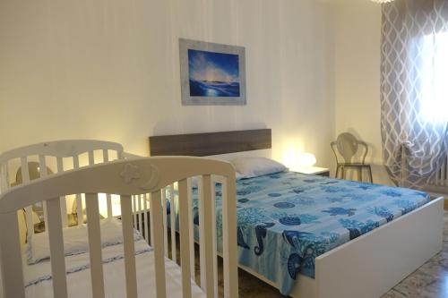 Ένα ή περισσότερα κρεβάτια σε δωμάτιο στο Don Alfonso Apartaments