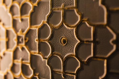 a close up of a gold plate with a screw at Quite Simply French in Lancaster