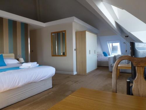 Postel nebo postele na pokoji v ubytování Boathouse Hotel