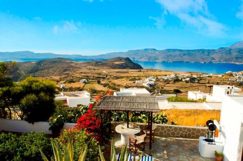 a view from a house with a view of the water at Drougas' Windmill in Plaka Milou